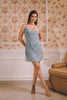 A pastel blue embellished mini dress with delicate pearl and crystal embroidery, crafted for playful elegance. Perfect for cocktail parties, destination wedding brunches, and luxe soirées.