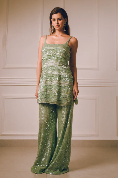 A mint green sequin co-ord set with layered detailing, crafted for effortless movement and modern flair. Designed for cocktail nights, sangeet celebrations, festive  soirées, and fashion-forward parties