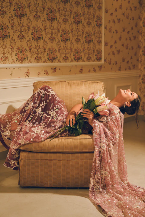 A blush pink hand-embroidered saree with shimmering sequins and delicate floral motifs. Perfect for weddings and evening soirées.