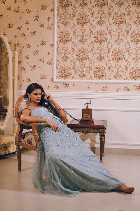 A pastel blue embellished skirt paired with a structured satin top, blending modern chic with couture detailing. Designed for women who love effortless mix-and-match glamour. Perfect for engagement parties, wedding festivities, and festive soirées.