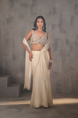 Ivory Embroidered Blouse And Stitched Draped Saree