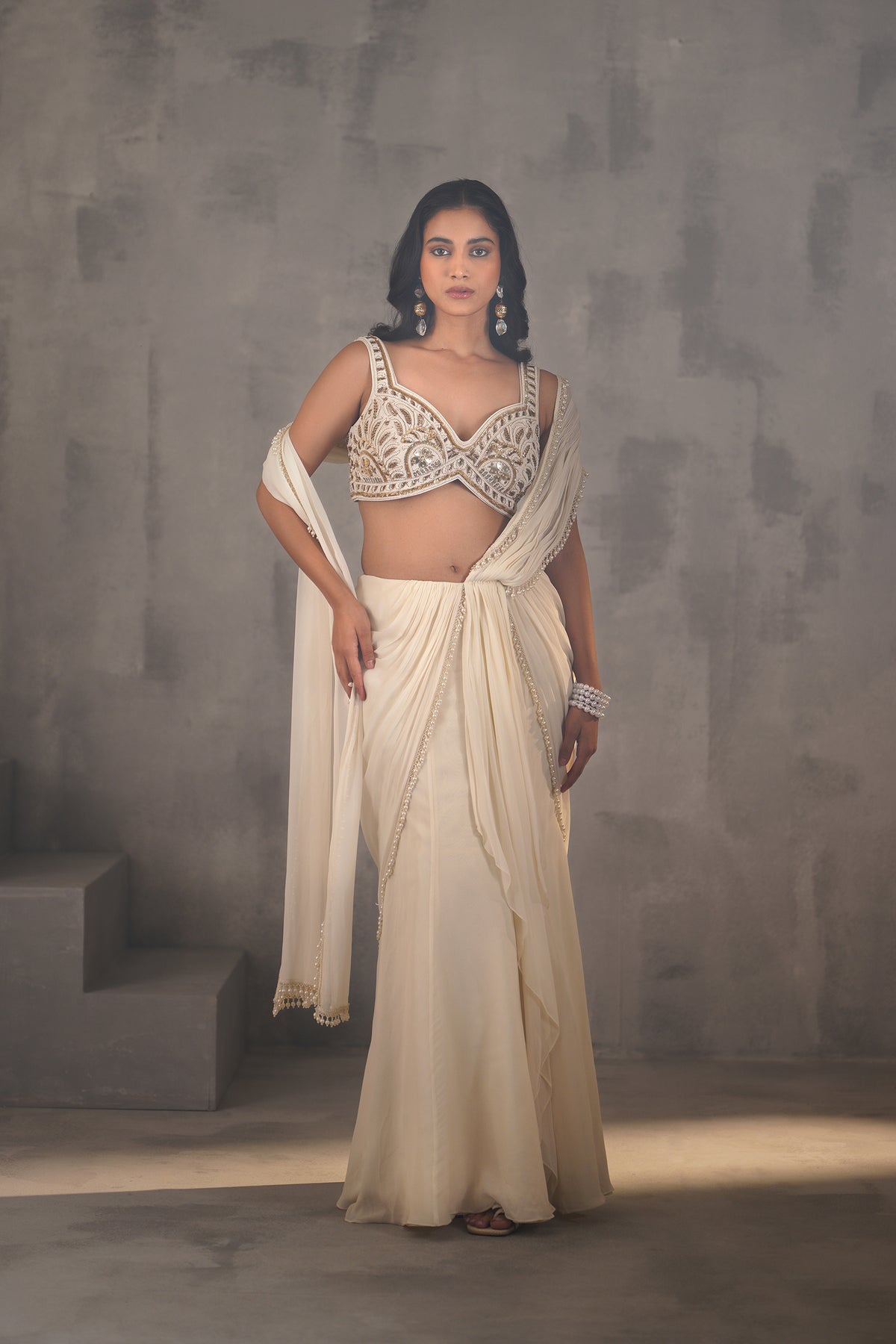 Ivory Embroidered Blouse And Stitched Draped Saree