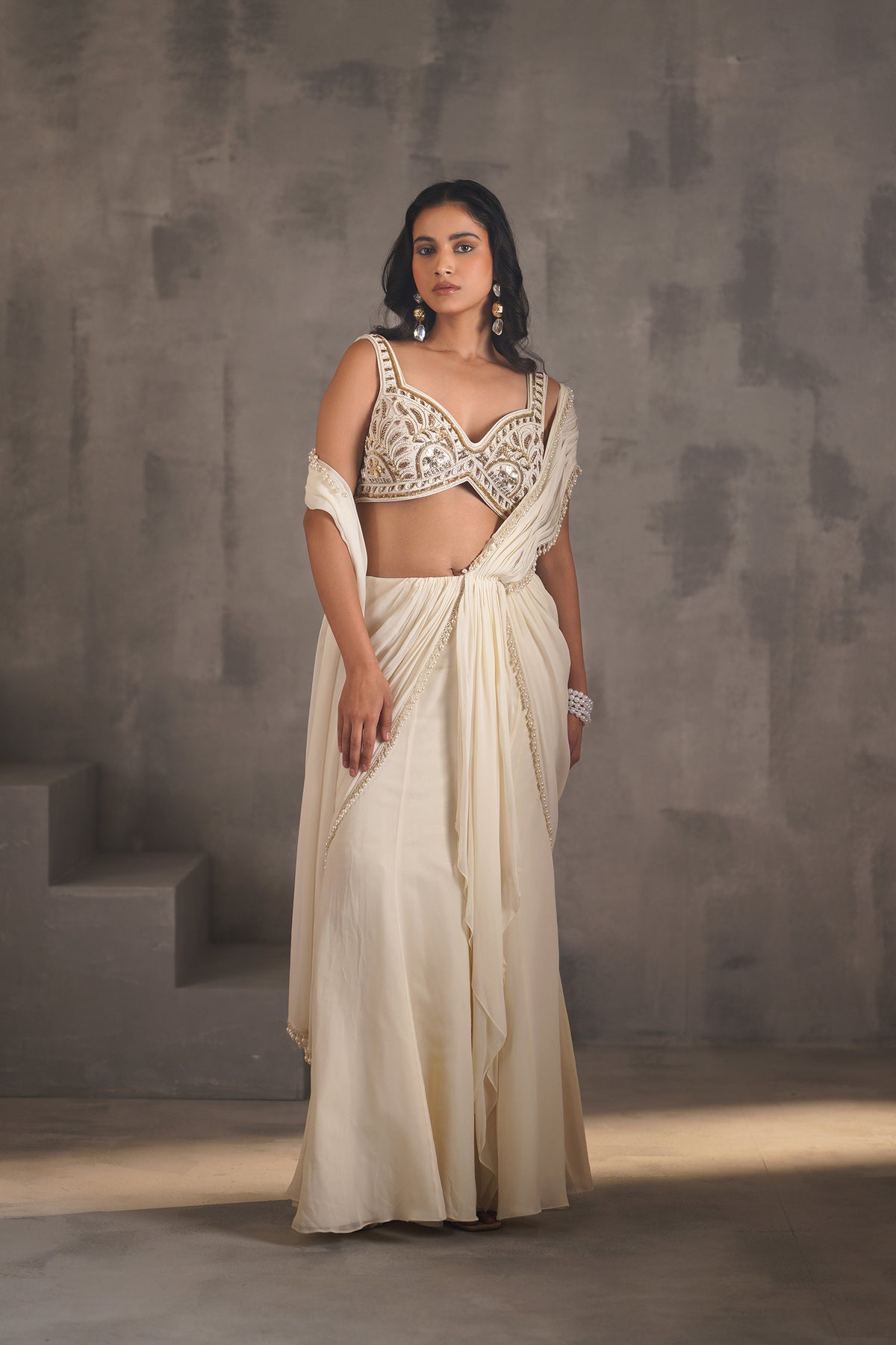 Ivory Embroidered Blouse And Stitched Draped Saree