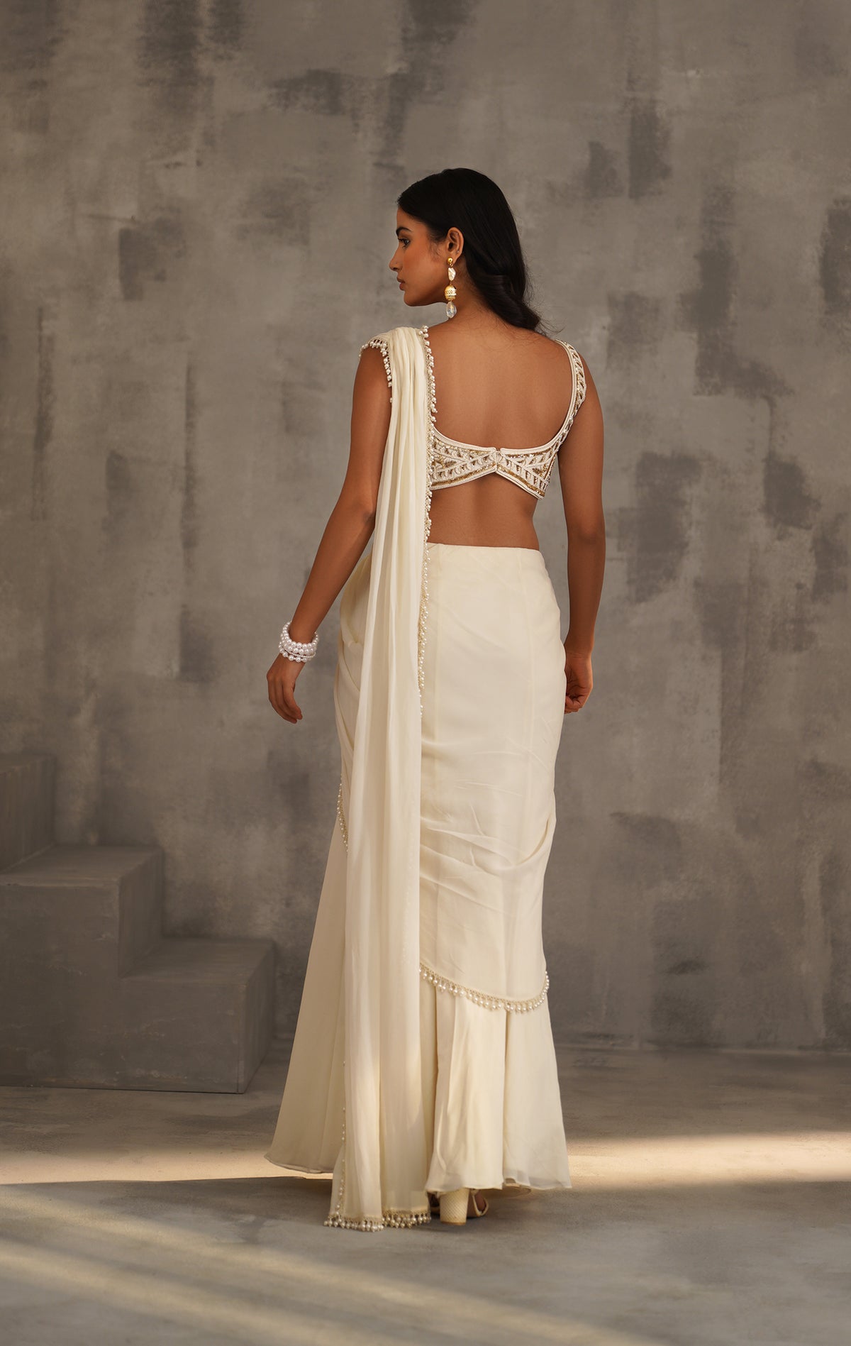 Ivory Embroidered Blouse And Stitched Draped Saree