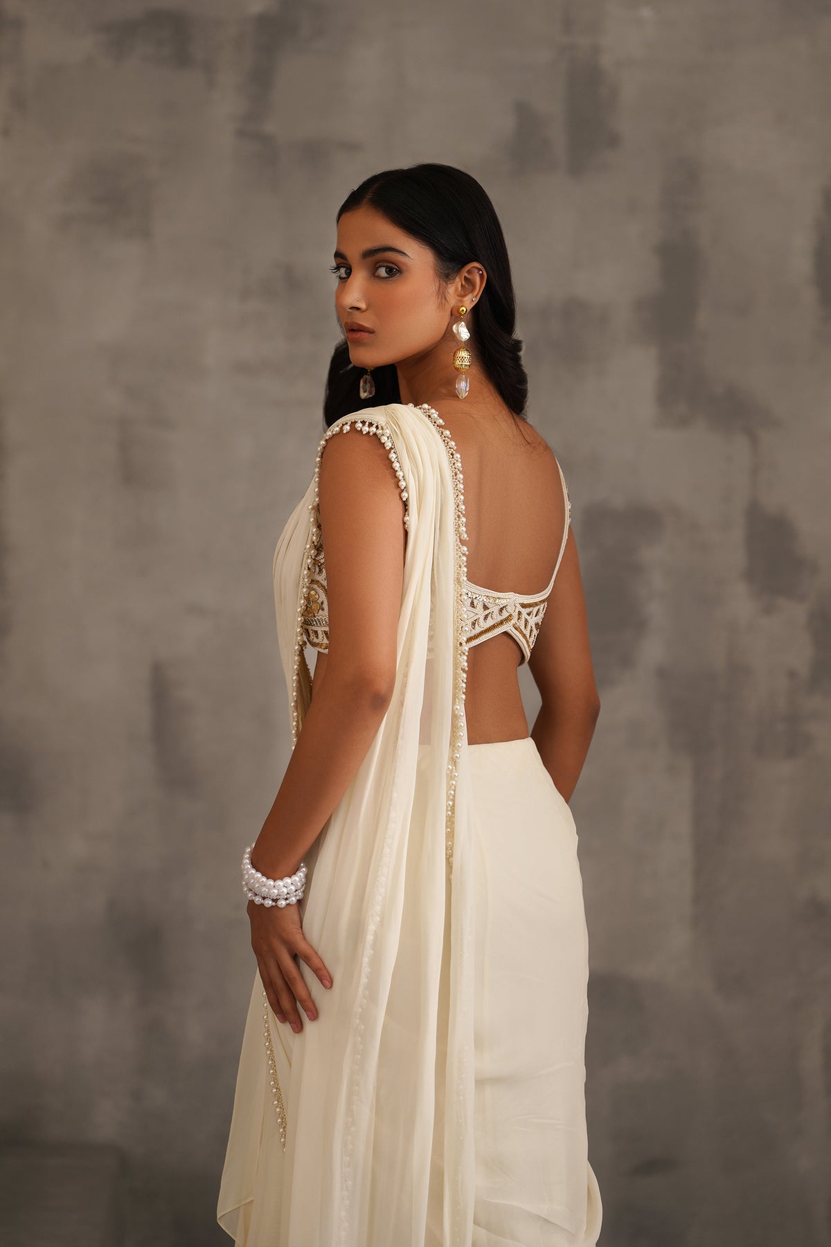 Ivory Embroidered Blouse And Stitched Draped Saree