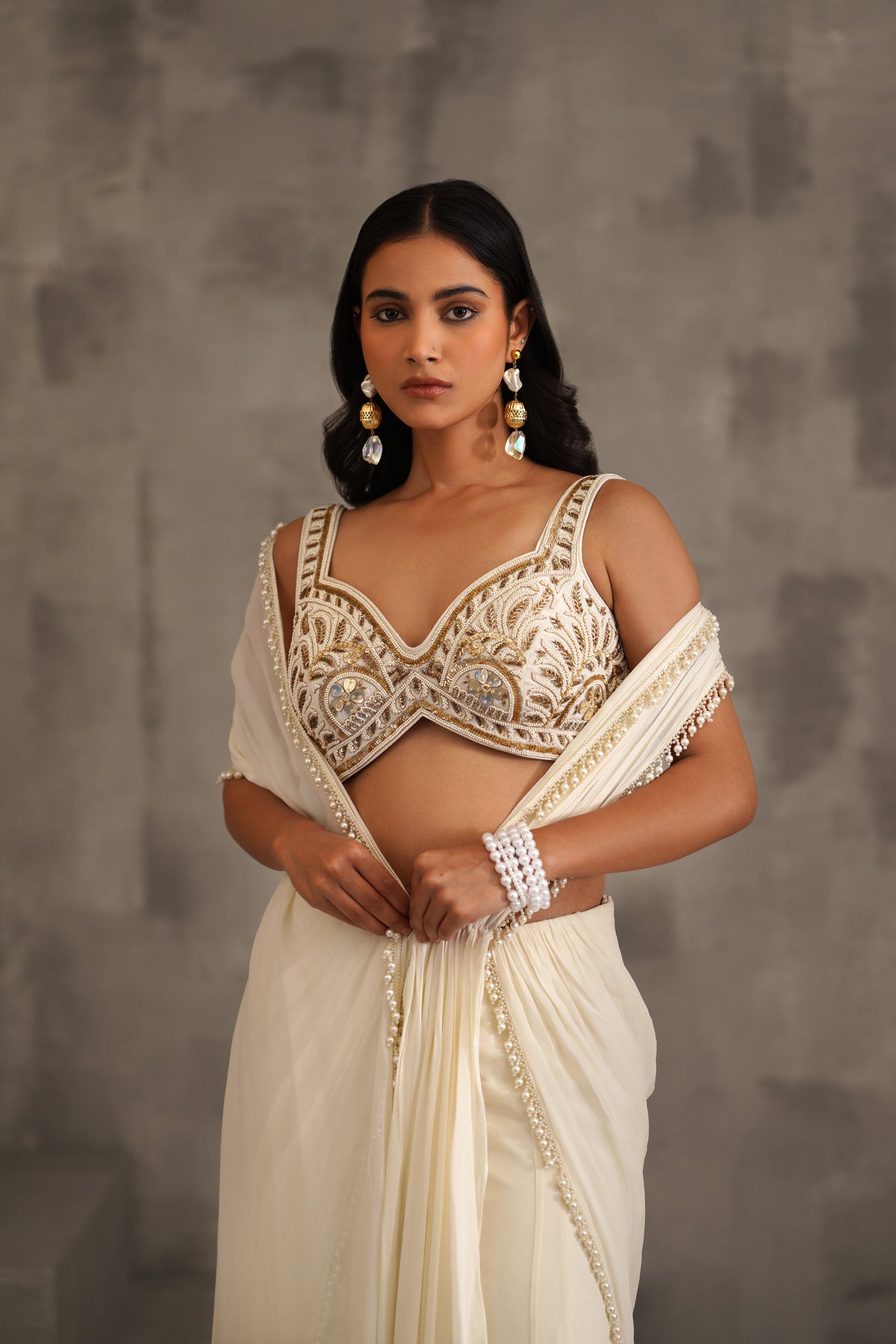 Ivory Embroidered Blouse And Stitched Draped Saree