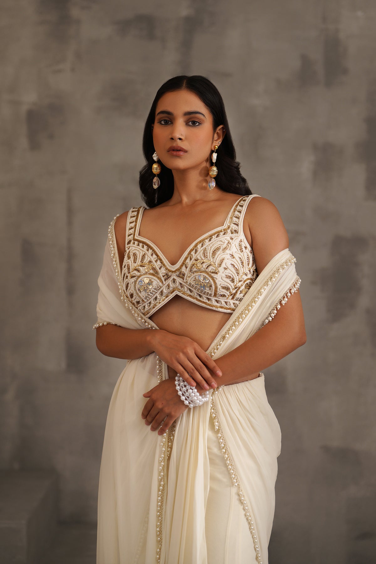 Ivory Embroidered Blouse And Stitched Draped Saree