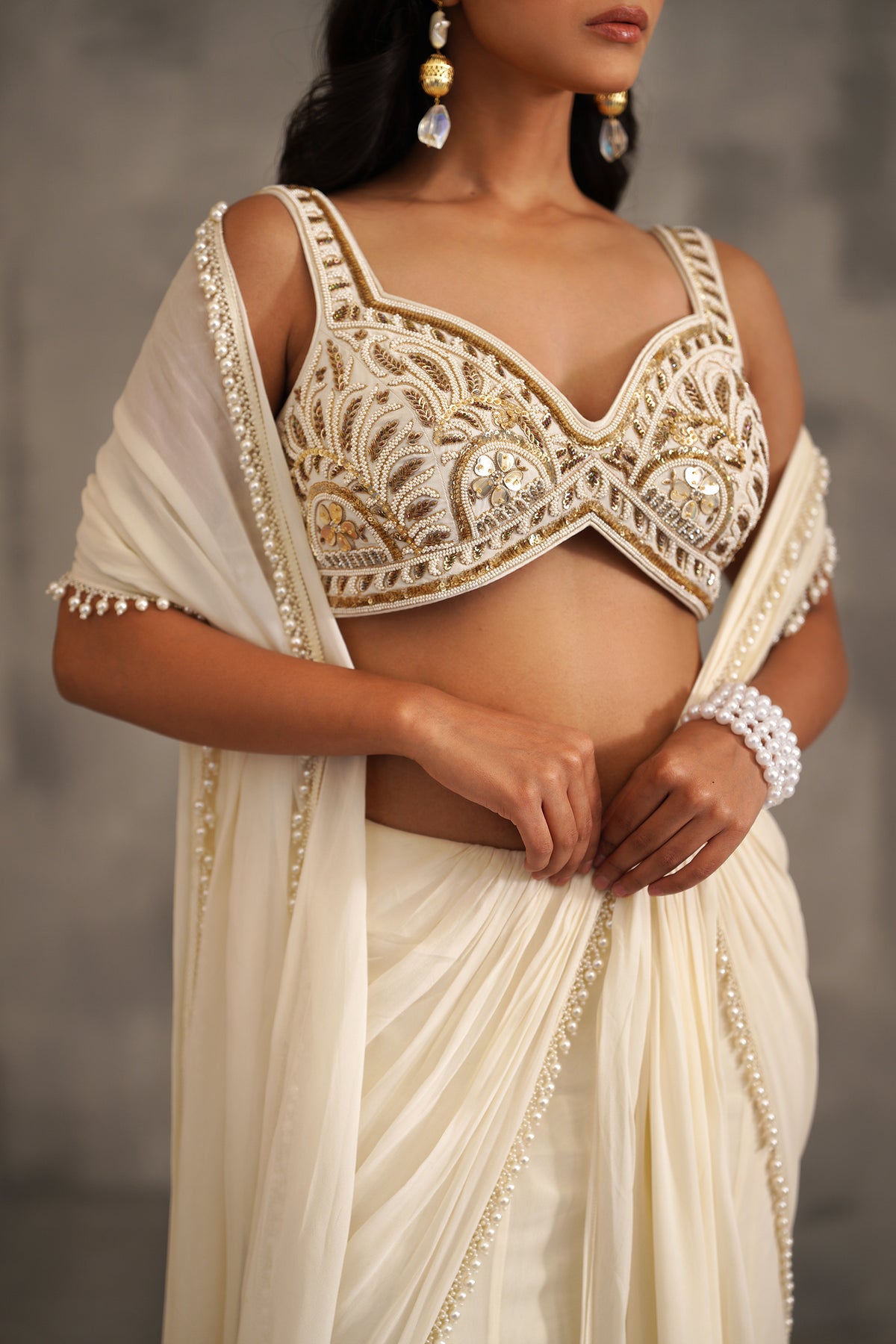 Ivory Embroidered Blouse And Stitched Draped Saree