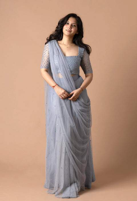 Pre Draped Saree In Net With Delicate Mirror Work With Pearls Paired With A Mirror Worked Blouse