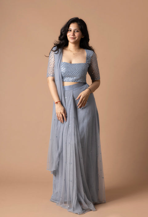 Pre Draped Saree In Net With Delicate Mirror Work With Pearls Paired With A Mirror Worked Blouse
