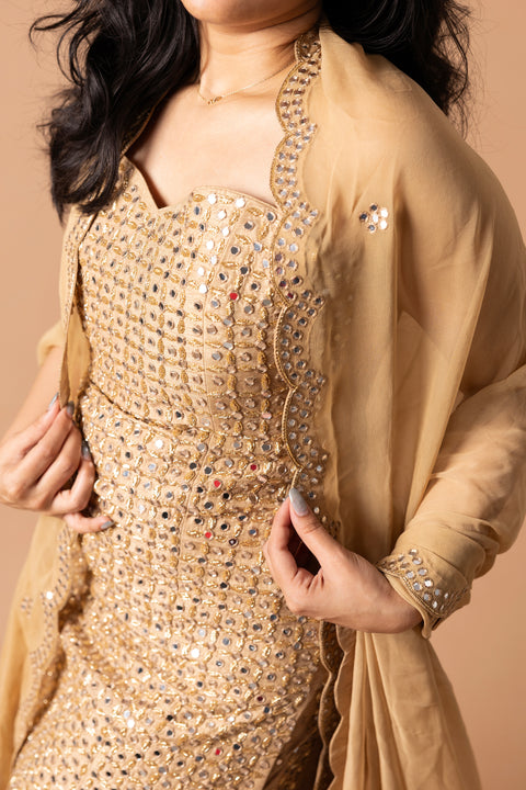 Corset Styled Tube Kurta Paired With Golden Falling Raw Silk Gharara Paired With Gorgette Dupatta