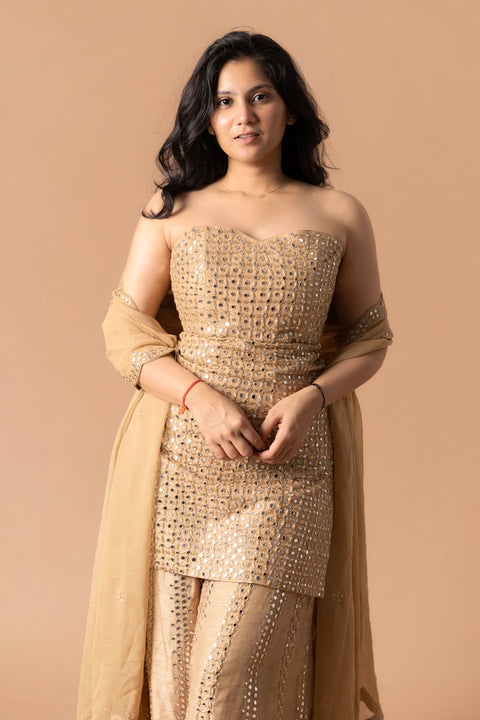 Corset Styled Tube Kurta Paired With Golden Falling Raw Silk Gharara Paired With Gorgette Dupatta