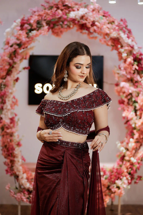 Wine Shimmera Off Shoulder Blouse With Drape Skirt And Net Dupatta