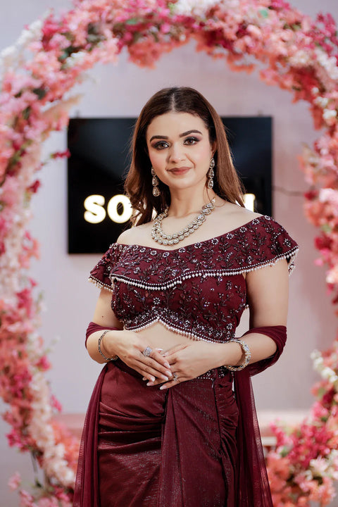 Wine Shimmera Off Shoulder Blouse With Drape Skirt And Net Dupatta